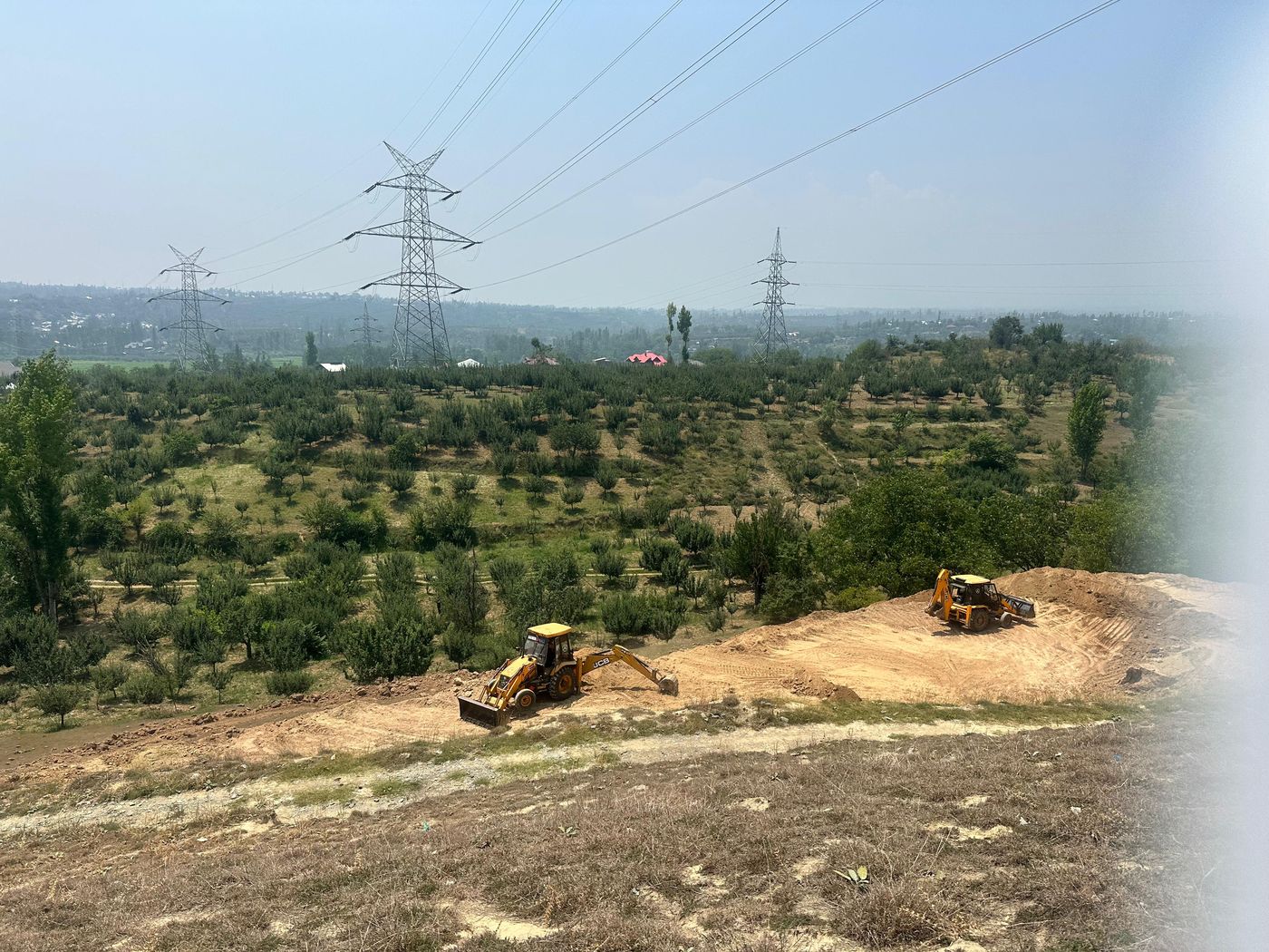Excavators cutting terraces